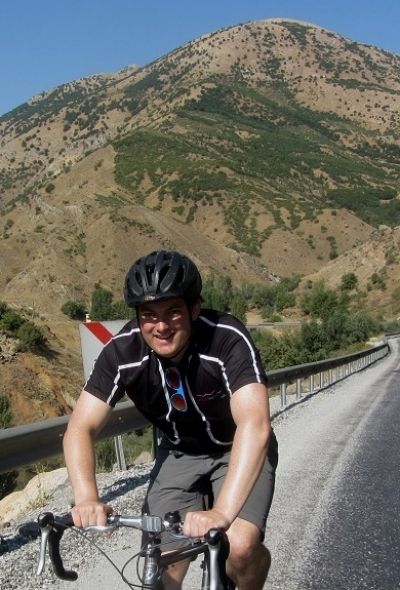 Alex Whitton Cycling on the  tour with redspokes
